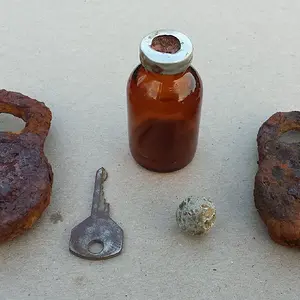 Some relics found where a Civil War Confederate hospital used to be. Included are 2 old locks, a key, an old syringe bottle and a round ball. Alll fou