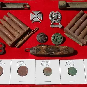 We frequently find WW2 U.S. Army maneuvers relics in our area. The USA knife was found in March 2016.