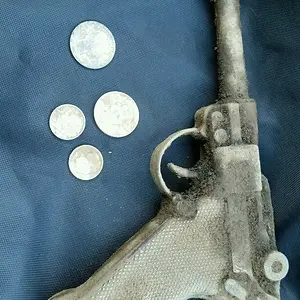 The Barber Quarter and gun was found by my friend.