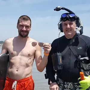 THIS GUY DOVE IN NEAR ME AND BOOGIE BOARDED IN - AS HE STOOD UP HE SAID "HOW'S IT GOING?" THEN HE REALIZED HE LOST HIS SUNGLASSES - I QUICKLY FOUND TH