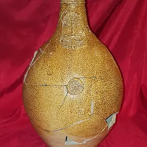 Reconstructed 17th century Bellarmine (aka Bartmann) jug. Shards dug from the "Swamp Pit"