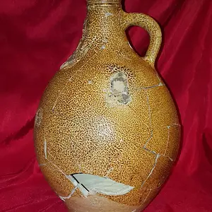 Reconstructed 17th century Bellarmine (aka Bartmann) jug. Shards dug from the "Swamp Pit"