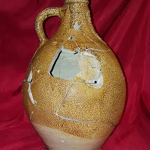 Reconstructed 17th century Bellarmine (aka Bartmann) jug. Shards dug from the "Swamp Pit"