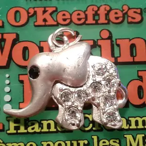 Little silver charm found on a beach
