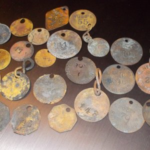 FEW EXAMPLES OF OLD BEACH TAGS - MOST OTHESE WOULD BE EARLY 1900S - THEY STOPPED USING BRASS FOR SUCH ITEMS WHEN WW II BROKE OUT - THESE USUALLY WOULD