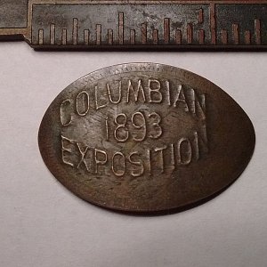 The first ever elongated souvenir penny. It was printed on a 1893 Indian Head cent at the Columbian Exposition World's Fair in Chicago.