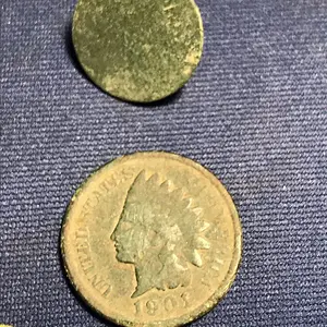Front of flat button and 1901 Indian Head Penny