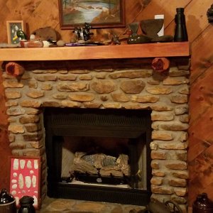 The fireplace.  Relics in frame on left found in Missouri when I lived there in the 1970's.  To the right is a civil war signal canon, heavy.
Very Ear