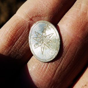 Engraved silver cufflink