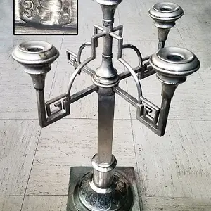 This is a huge 2-foot-tall candelabra. Made in Krakow, Poland in between the years 1920-1931. It is 80% pure silver and weighs 45.2 ounces. The man wh