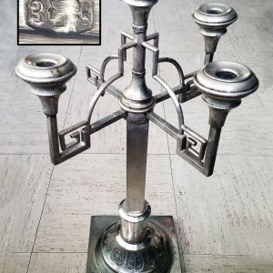 This is a huge 2-foot-tall candelabra. Made in Krakow, Poland in between the years 1920-1931. It is 80% pure silver and weighs 45.2 ounces. The man wh