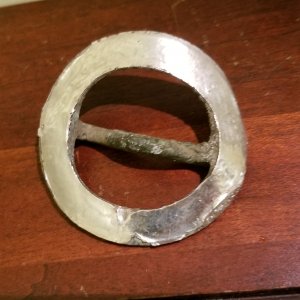 Applied silver annular buckle
