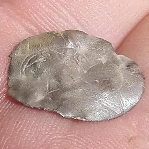 THIS IS A SILVER CUFF LINK - BEST GUESS IS THAT IT IS FROM THE 1600s - WITH IT BEING BEAT UP - WOULD NOT BE SURPRISED IF IT WAS PASSED AROUND AS MONEY