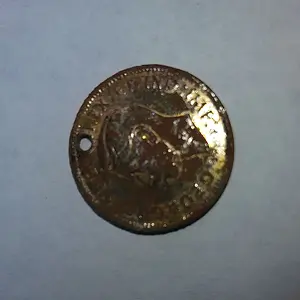 1942 Canadian Cent with hole (Front)