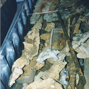 AtochaEO tub8: One of the tubs in the conservation labs, filled with encrusted objects that need to be kept submerged.  There should be at least one r