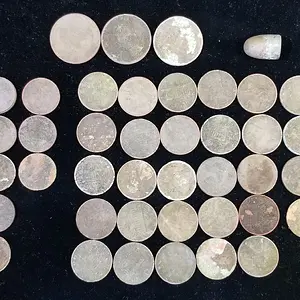$1.79 in Clad and one 9mm Bullet, April 15