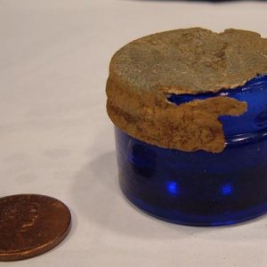 Little Blue Jar - The penny is for size comparison. Found this little jar while hunting a old home site.