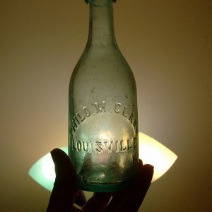 Blob Top Squat Soda Bottle, 1860-63 - The bottle was dug from a cellarhole, and it is marked "PHILO M. CLARK / LOUISVILLE KY."