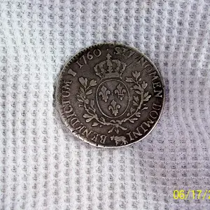 Reverse of 1760 coin i found it 8 inches deep - Iam not sure if this was minted in Canada ? its much bigger then a US silver dollar