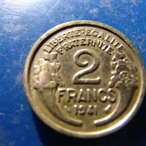 Coin which was laying in the same hole with the previous token. Looks too much like a gold coin when you first flip it out of the ground. Not good for