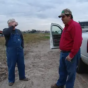 RickyP explaining to Cajunme the finer details of cooking clay pigeon found during a hunt !