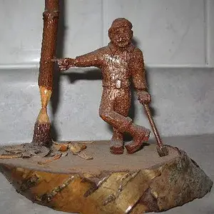 My little Lumberjack - I carved the man from a piece of mahogany, his axe from Brazillian
Rosewood. Made sometime back in the 70's.