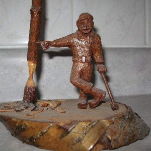 My little Lumberjack - I carved the man from a piece of mahogany, his axe from Brazillian
Rosewood. Made sometime back in the 70's.