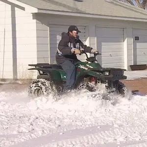 Our son plowing through - The ATV has become the general purpose workhorse on a farm or ranch nowadays.  Replaced the horse or mule for the most part.
