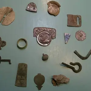 My favorite relics of 2009.   - From the 8 o'clock position, going clockwise: a small clock or cupboard key, an early brass furniture decoration, the 
