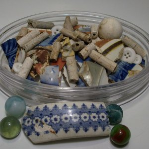 Colonial clay pipe stems, pottery and china, and some later marbles eyeballed in the fields.