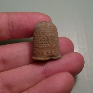 French thimble with the inscription "Un Seul Me Suffit" which means "Only One Is Enough."