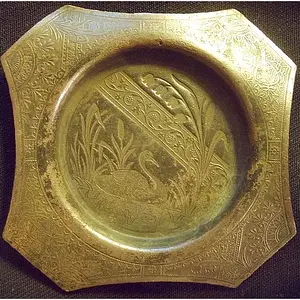 brass item - unknown. 2.5" across