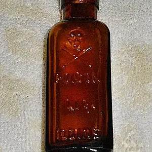 Brougham Hotel Site - Skull & Crossbones Poison Bottle