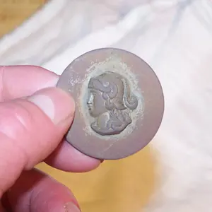 What am I? I found recently in old town town park and I can not find any info on it. I am not sure if its a button or shoe buckle or whatever. Any ide