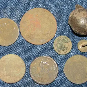 Three LC's, Russian kopek, indian head cent, canadian bank token, small flat button and a croto bell.
Oct.2012