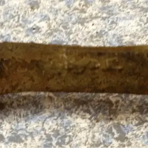 I can't make out the mark. Down time research. Dig first...research later.