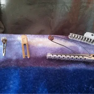 All are curling tools made in Hollywood. Also made of metal and aluminum. Two different types of clips ( pin curl clips and krippies) and metal curlin