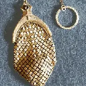 Extremely RARE - Tiny Brass Mesh Rosary Ring purse.
No makers mark, but suspect it is by Whiting & Davis. These are VERY RARE, with tiny brass rosary 