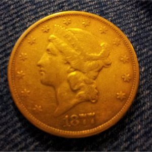 Double Eagle $20.00 Gold Piece. Was found in a old farm house in Missouri that belongs to my family. The coin was found among books.