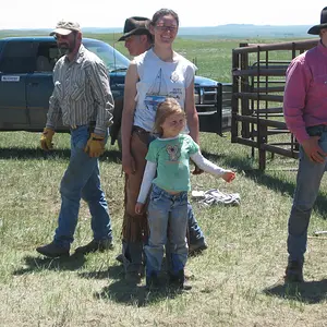 More smiles while they are waiting for a roped calf to come by.