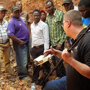 OKM field trainer answers questiond of gold seekers in Tanzania.