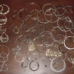 EARINGS FROM ONE YEAR - LEFT ARE GOLD AND SILVER BELOW , JUNK ONES ON THE RIGHT
