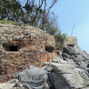 Pill box on a small island near Vung Tau.   You can see bullet holes all over it.