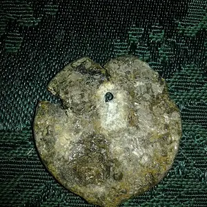 Has a hole at top middle