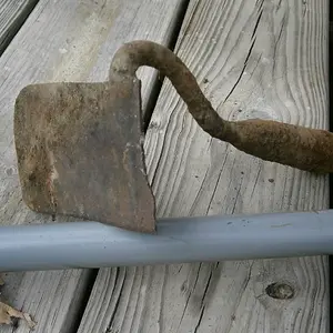half a garden hoe, well worn and filed blade concave