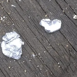 Silver? Platinum? White gold? It doesnt melt below 600' so not galeena..