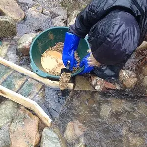 Feeding his sluice.
