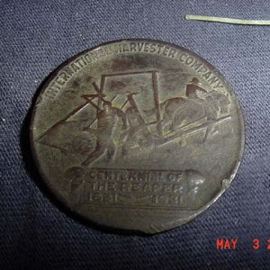 Reverse of 1931 Token from the International Harvester Company celebrating the centennial of the McCormick Reaper