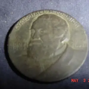 Obverse of 1931 Token from the International Harvester Company celebrating the centennial of the McCormick Reaper