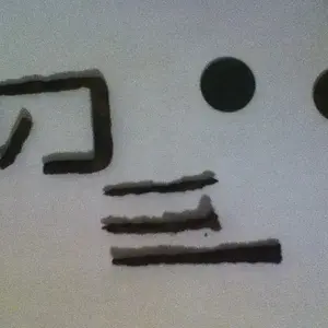 A buckle some nails and two coins.